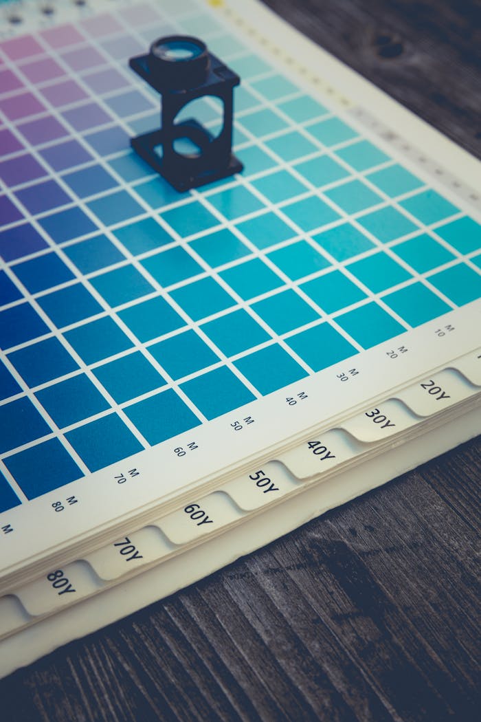 A color palette with a magnifying glass tool, ideal for design and printing work.